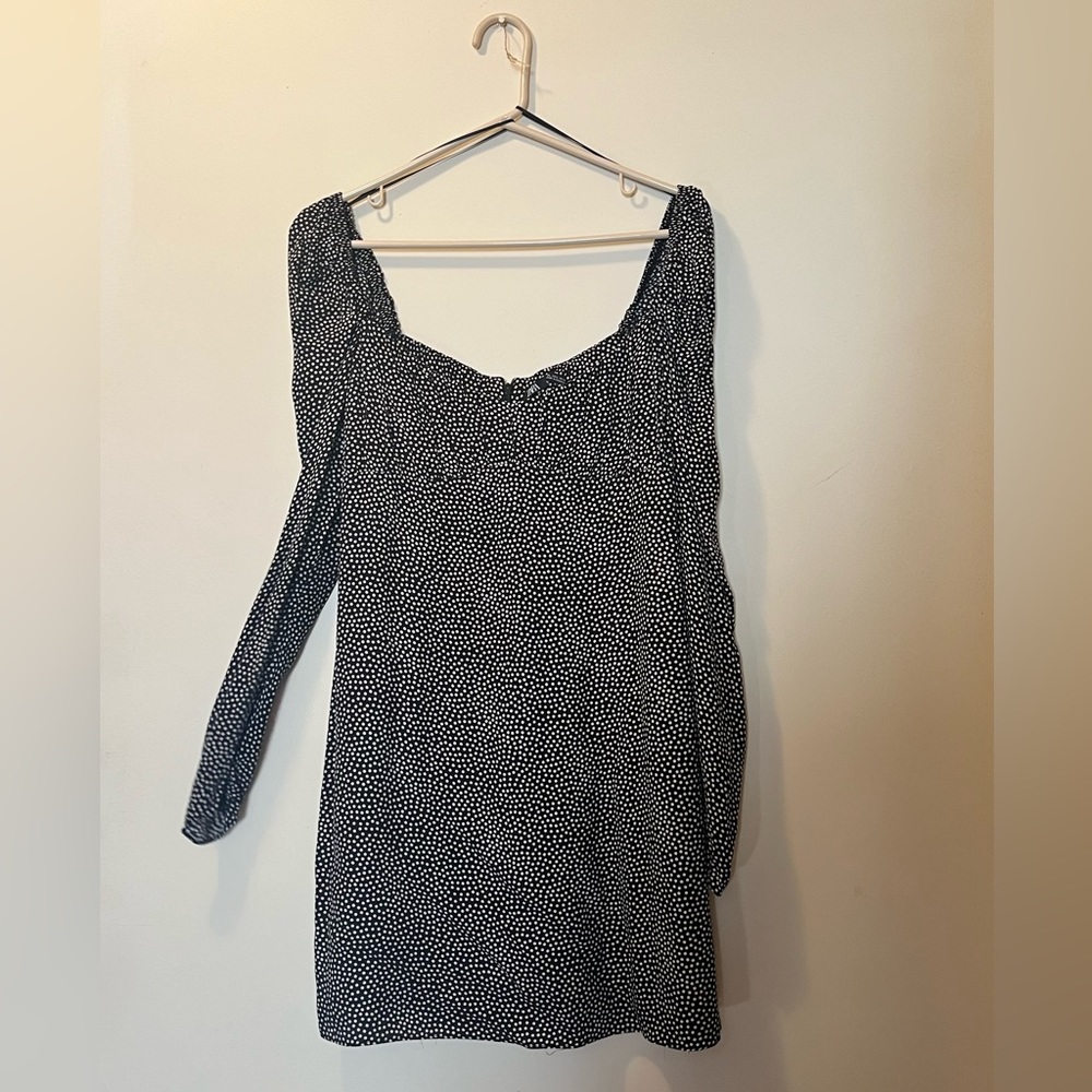 Long sleeve black dress with white polkadots